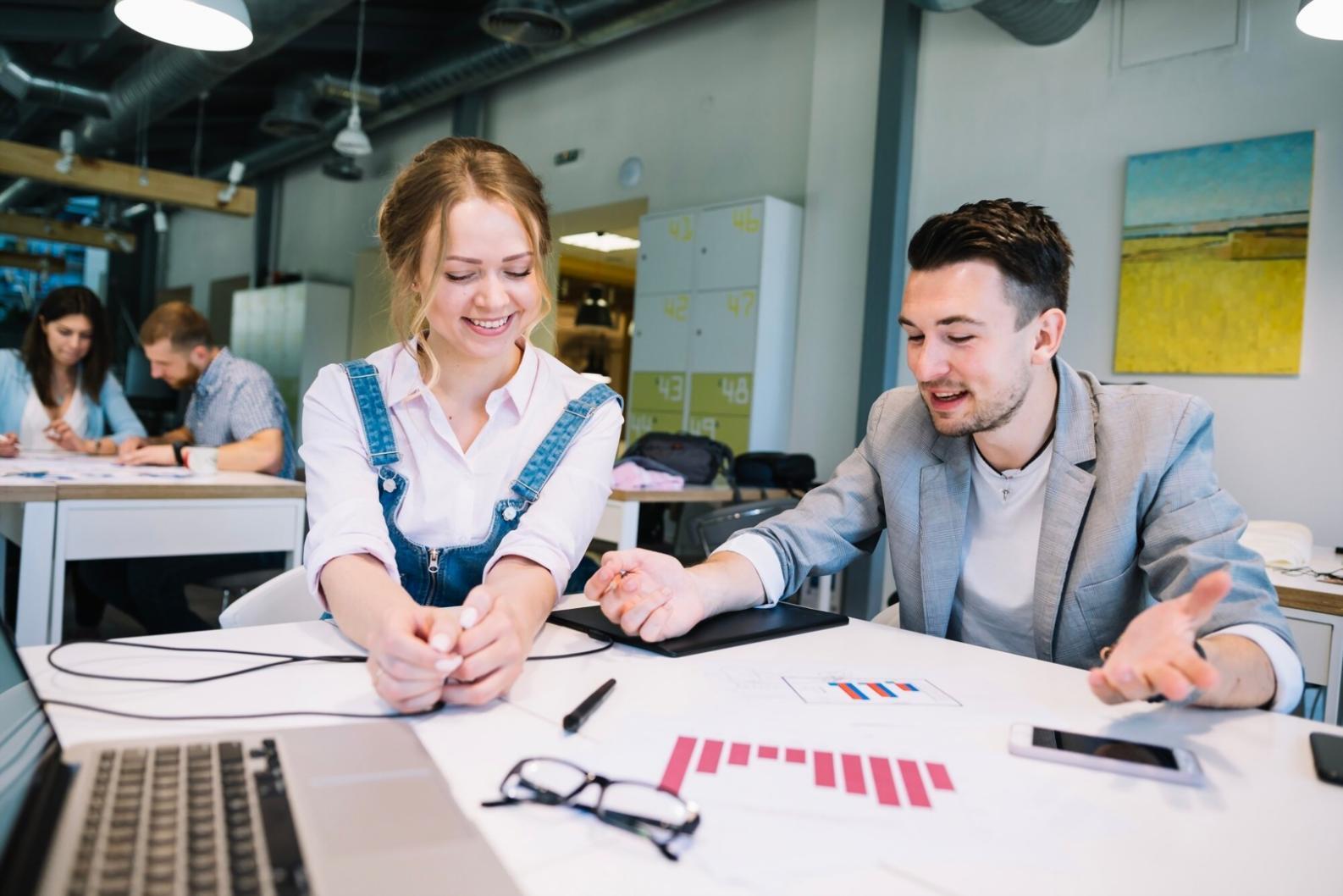 Professional budgeting consultation meeting with financial documents and charts
